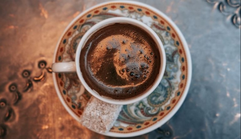 A cup of Turkish coffee on saucer 