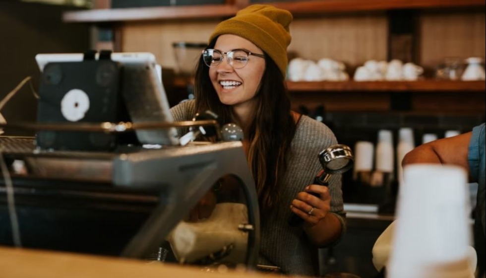 Barista smiling in a coffee shop