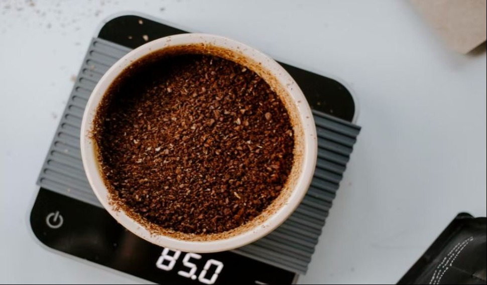 Cup of coffee grounds in scales 