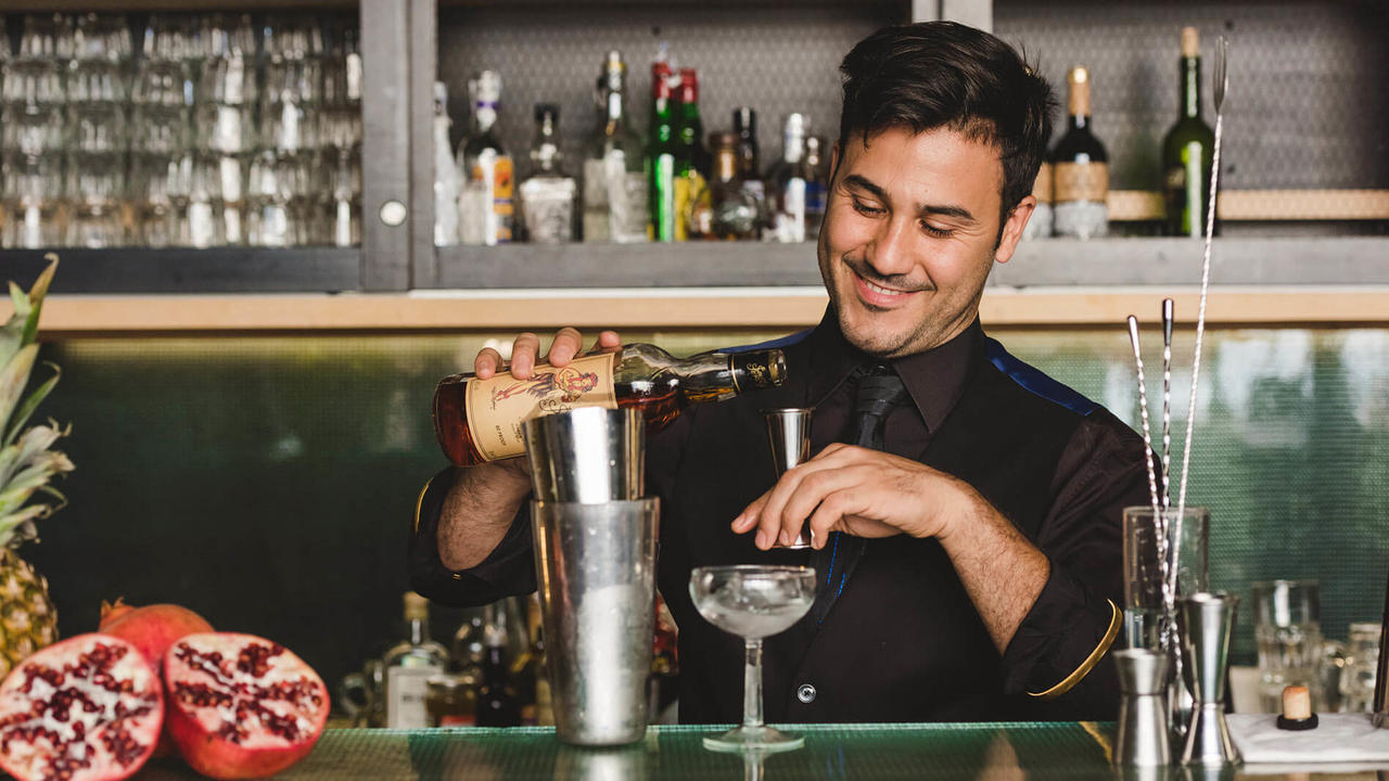 bartender smiling sailor jerry pour