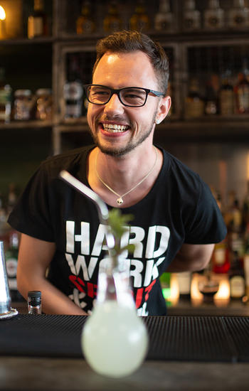 EBS student serving a cocktail