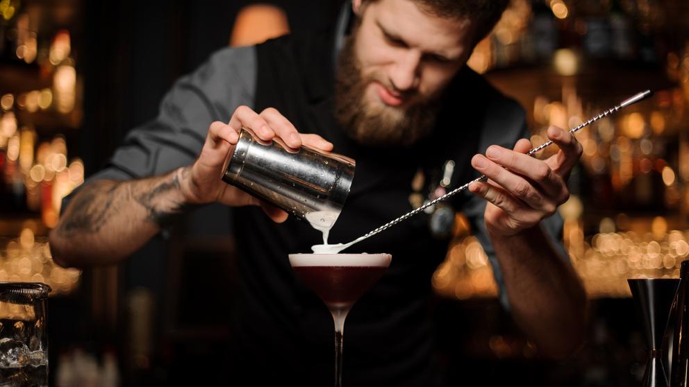 bartender using bar spoon tool