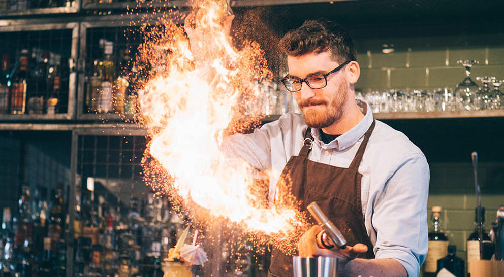 Bartender-performing-flair-tricks-with-fire