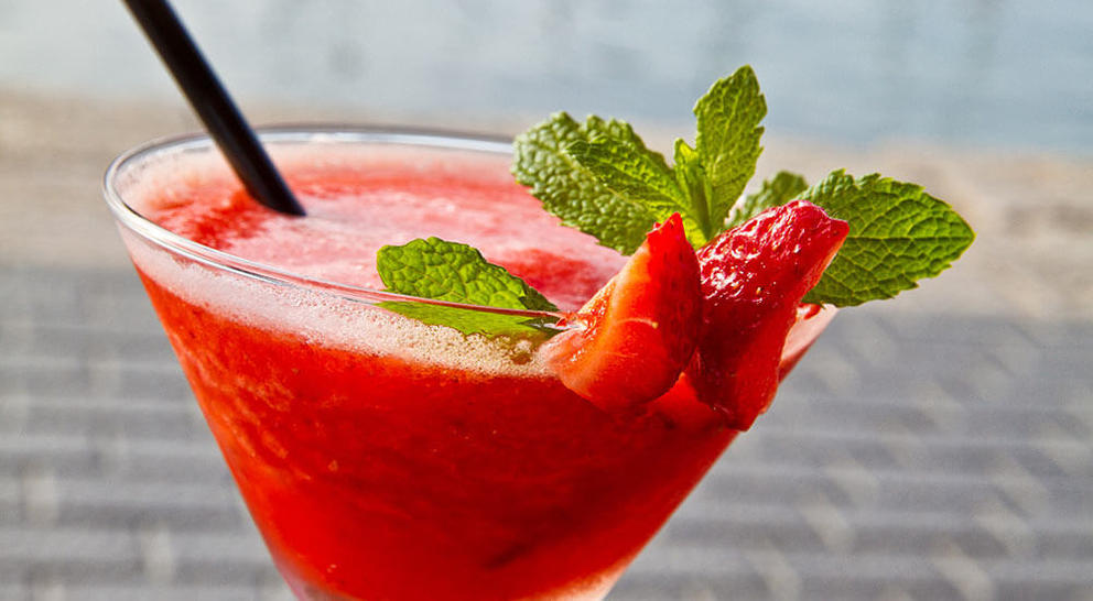 frozen-strawberry-daiquiri-with-mint-and-a straw