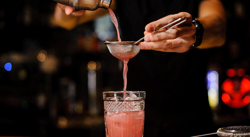 pink cocktail pour